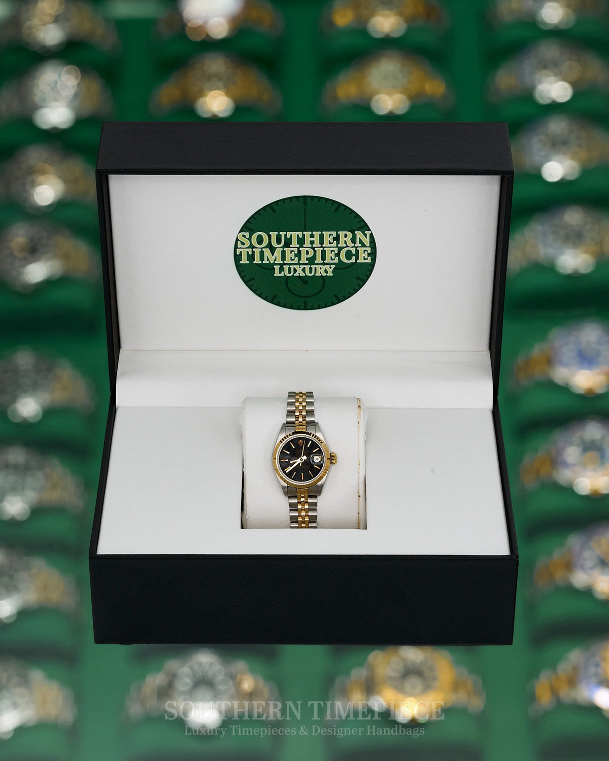 26mm Rolex Datejust with Black Tapestry Stick Dial in 18kt Yellow Gold and Stainless on Jubilee (Ref: 69173)(Year: 1986)