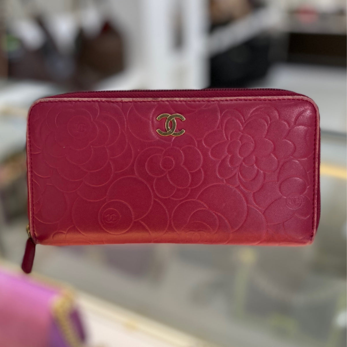 Chanel Pink Camellia Embossed Zippy Wallet