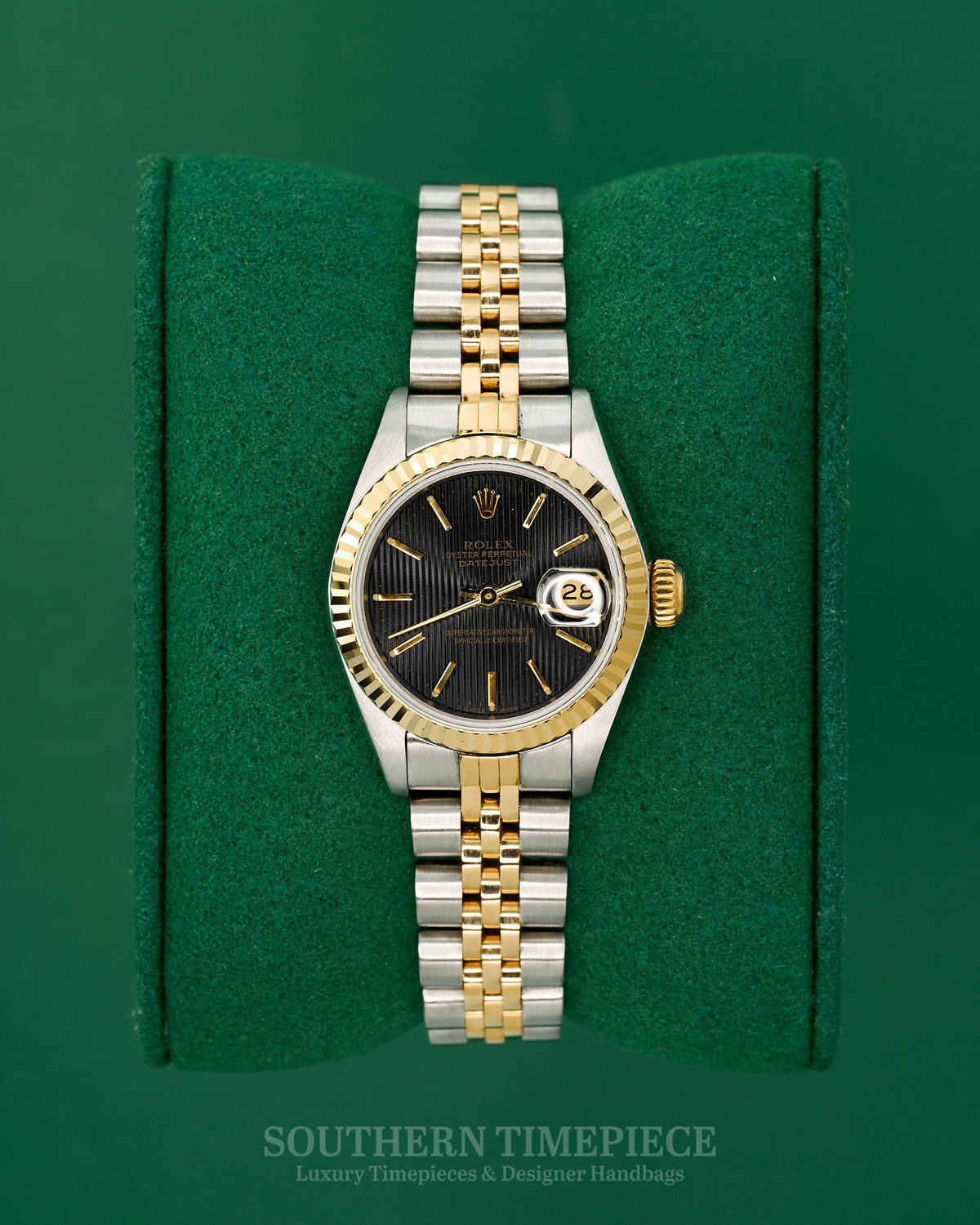 26mm Rolex Datejust with Black Tapestry Stick Dial in 18kt Yellow Gold and Stainless on Jubilee (Ref: 69173)(Year: 1986)
